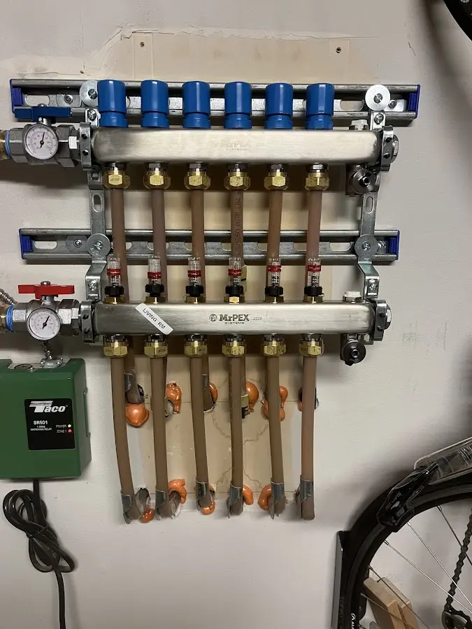 Plumber performing Water Heater Repair at a residential property in Fairfax